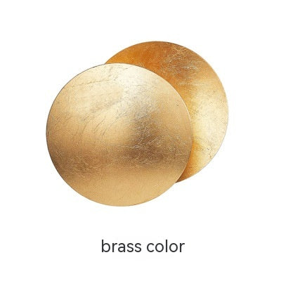 Two brass-colored circular objects on a white background with 'brass color' text.