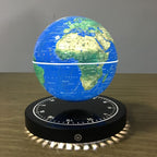 Levitating地球仪 on a wooden surface with a gray background