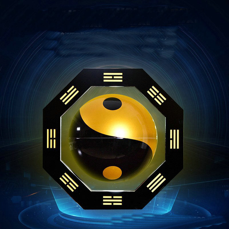 Decorative wall art with a yin yang symbol on a dark background