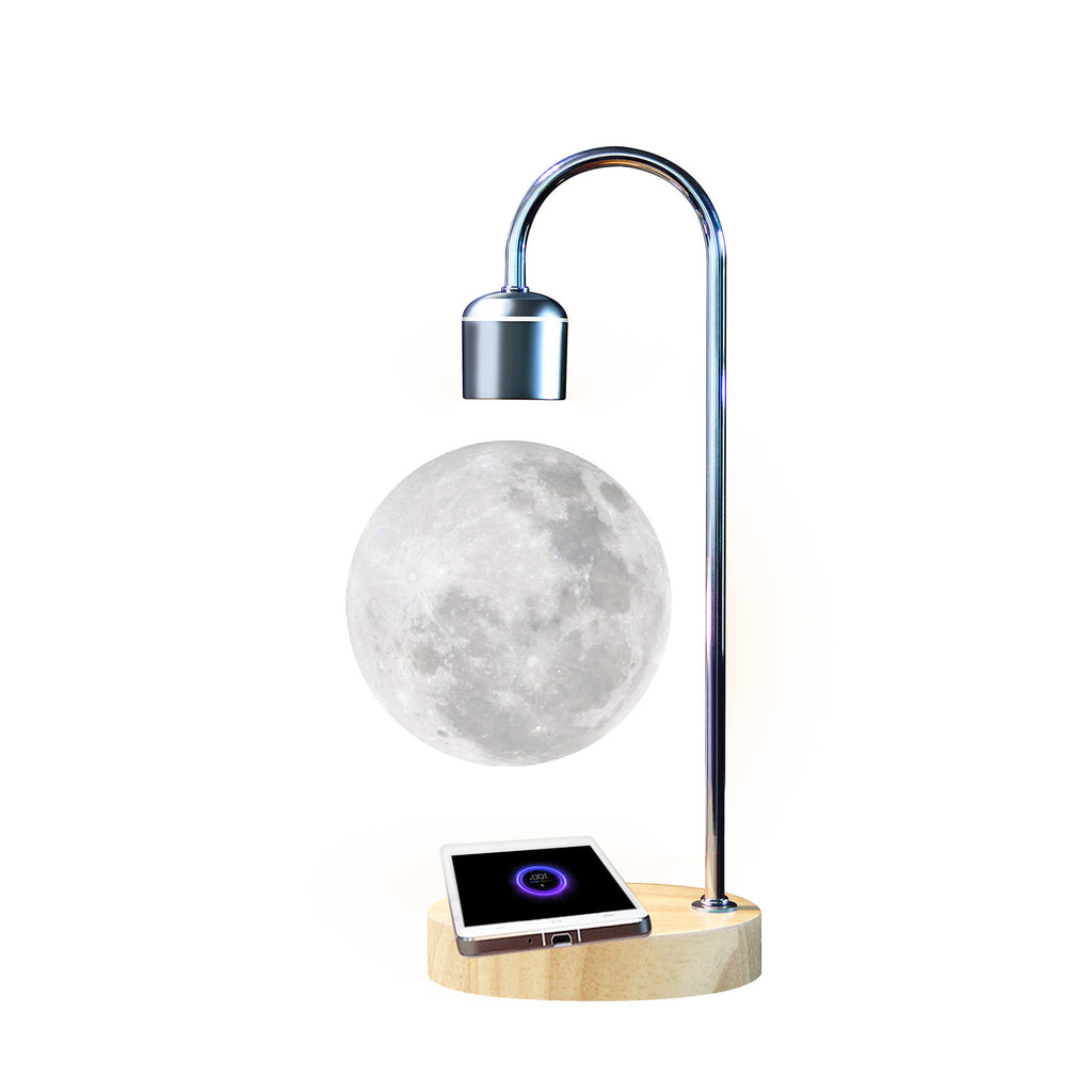 Levitating moon lamp with wooden base on a white background