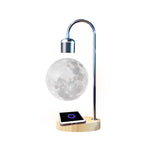 Levitating moon lamp with wooden base on a white background