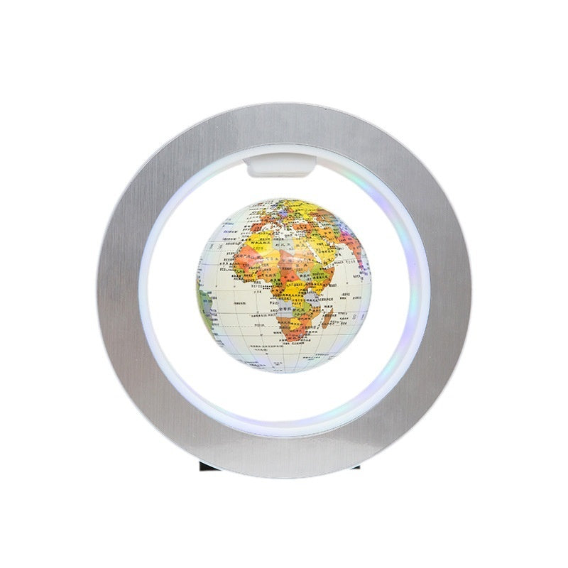 Globular world map with a metallic rim on a white background