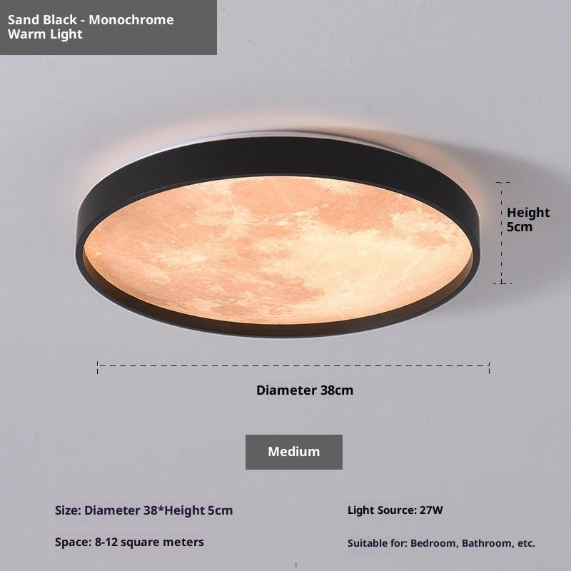 Ceiling light fixture with sand black finish and warm light on a gray background