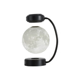 Moon lamp with black base and arm on a white background