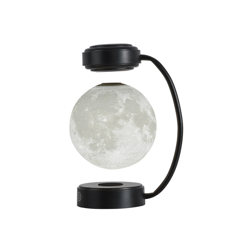 Moon lamp with black base and arm on a white background