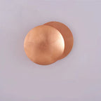 Copper wall sconce on a light gray background