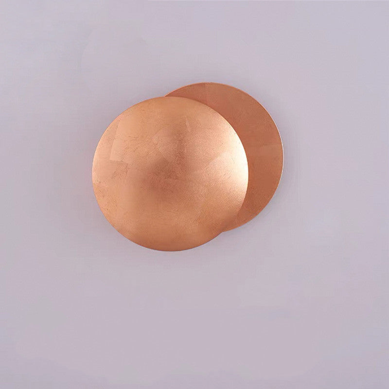 Copper wall sconce on a light gray background
