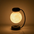Glowing spherical lamp with a black base and arm on a brown background