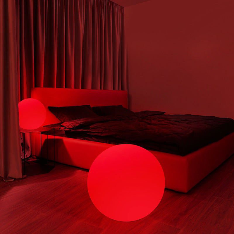 Red-themed bedroom with a bed and glowing red sphere.