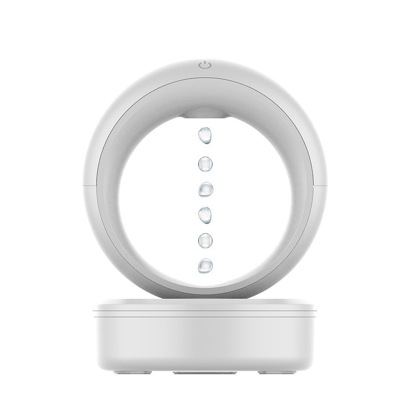 White electronic device with circular top and rectangular base on a white background