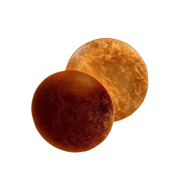 Two round, brown objects on a white background