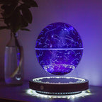 Levitating purple sphere with star constellations on a dark surface.