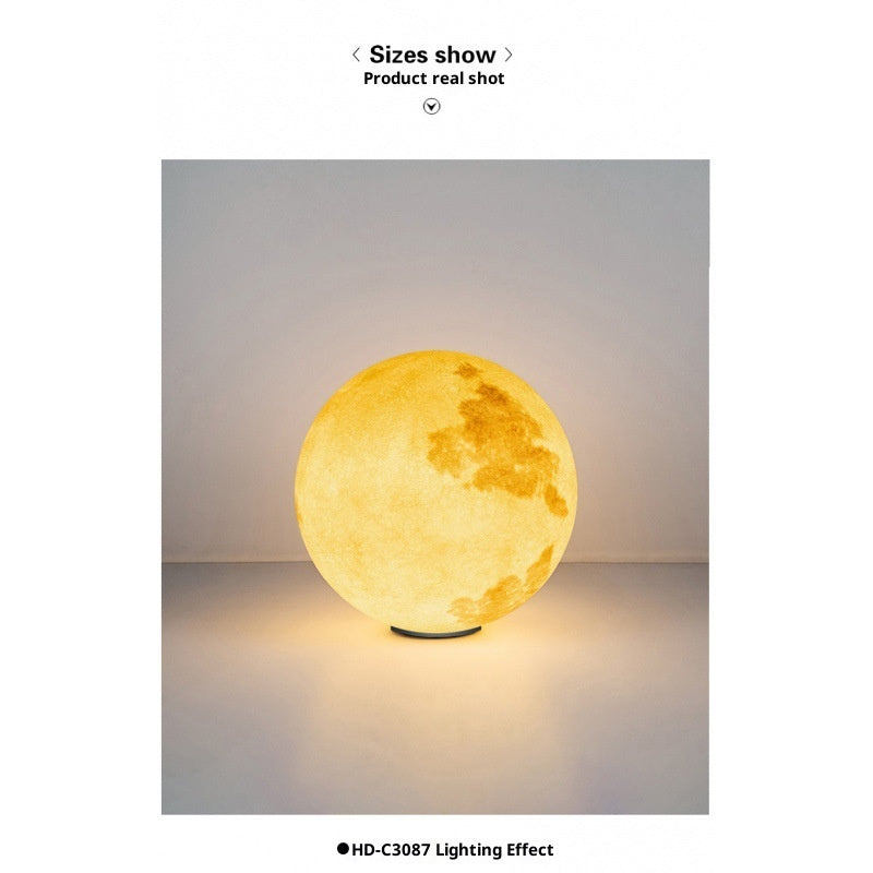 Spherical lamp with a warm glow on a gray background