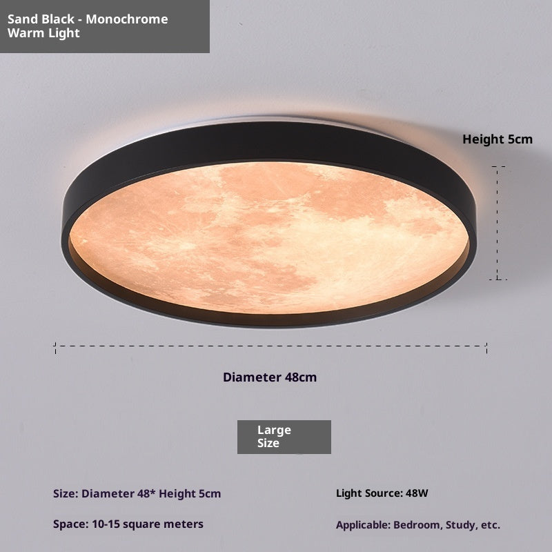 Ceiling light fixture with sand black finish and warm light on a gray background