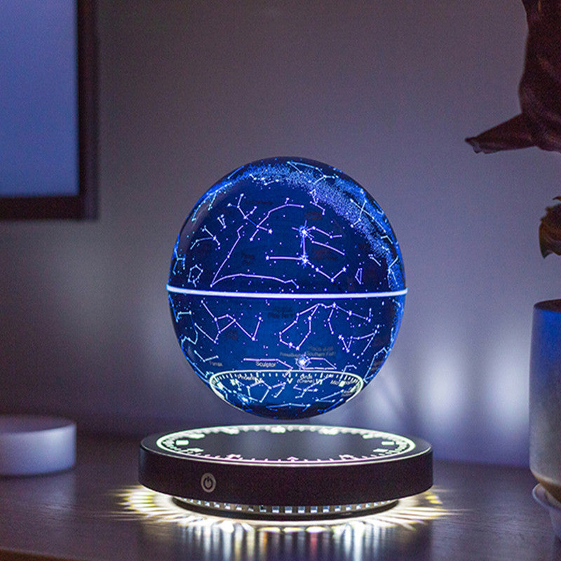 Levitating star map light on a table with a blurred background