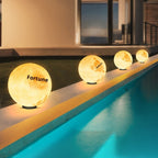Glowing spherical lights labeled 'Fortune' along a pool edge.