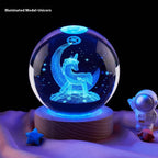 Crystal ball with unicorn design on a dark background